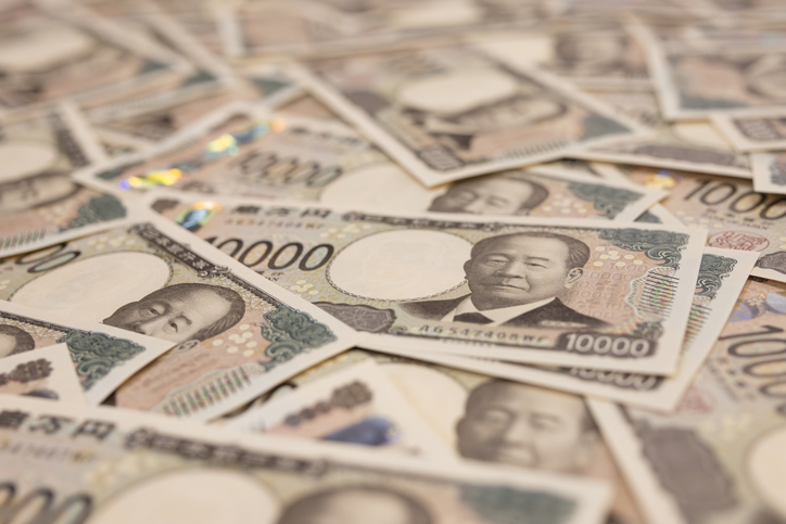 Japan's new banknotes. Image of a large number of 10,000 yen notes laid out.